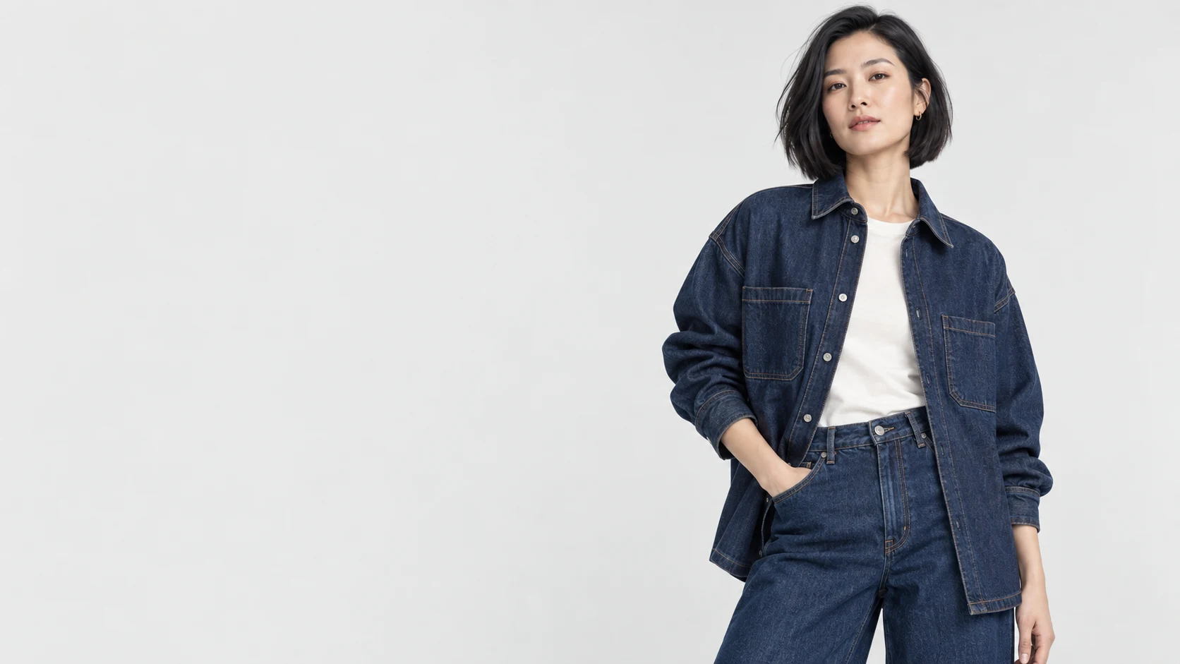 Fashion model wearing an indigo denim shirt and jeans