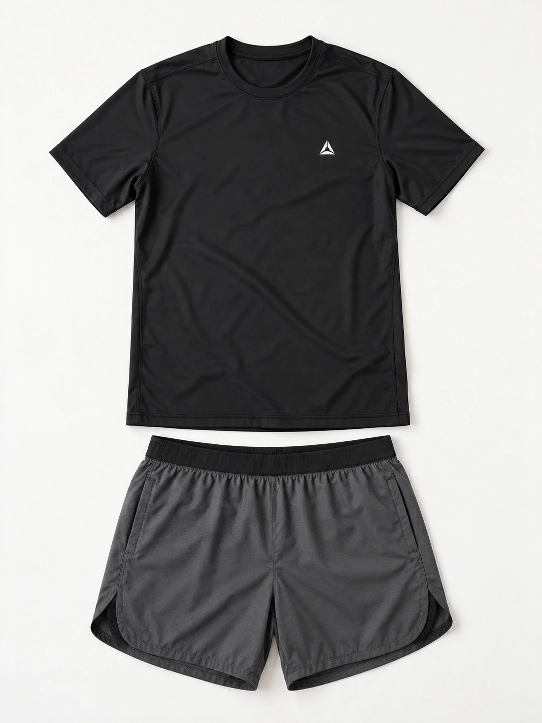 Flat lay of a men's black training t-shirt and grey running shorts