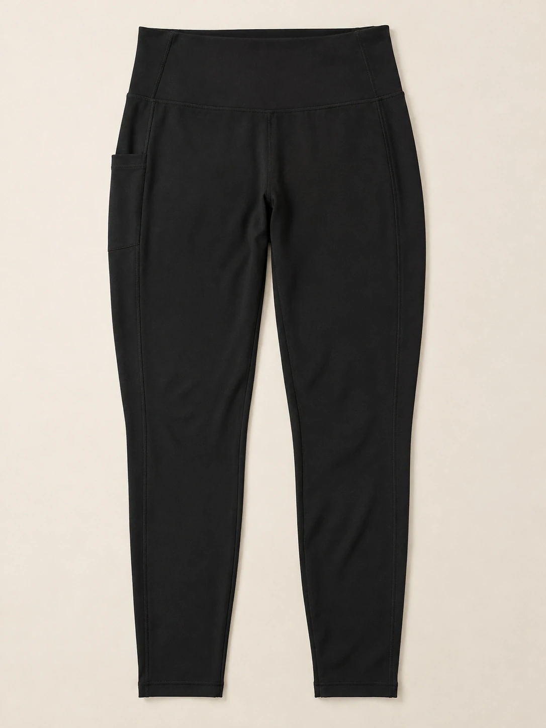 Flat lay of plus-size black high-waisted yoga leggings