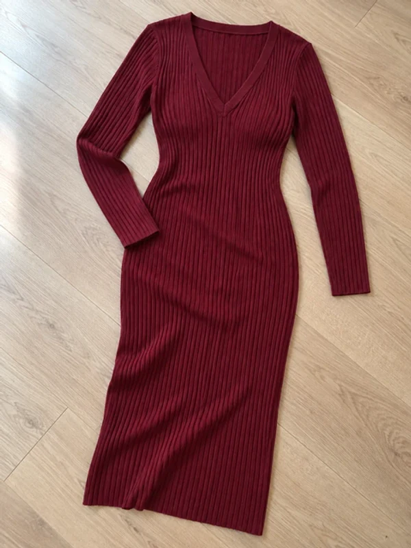 Flat lay of a burgundy rib-knit dress